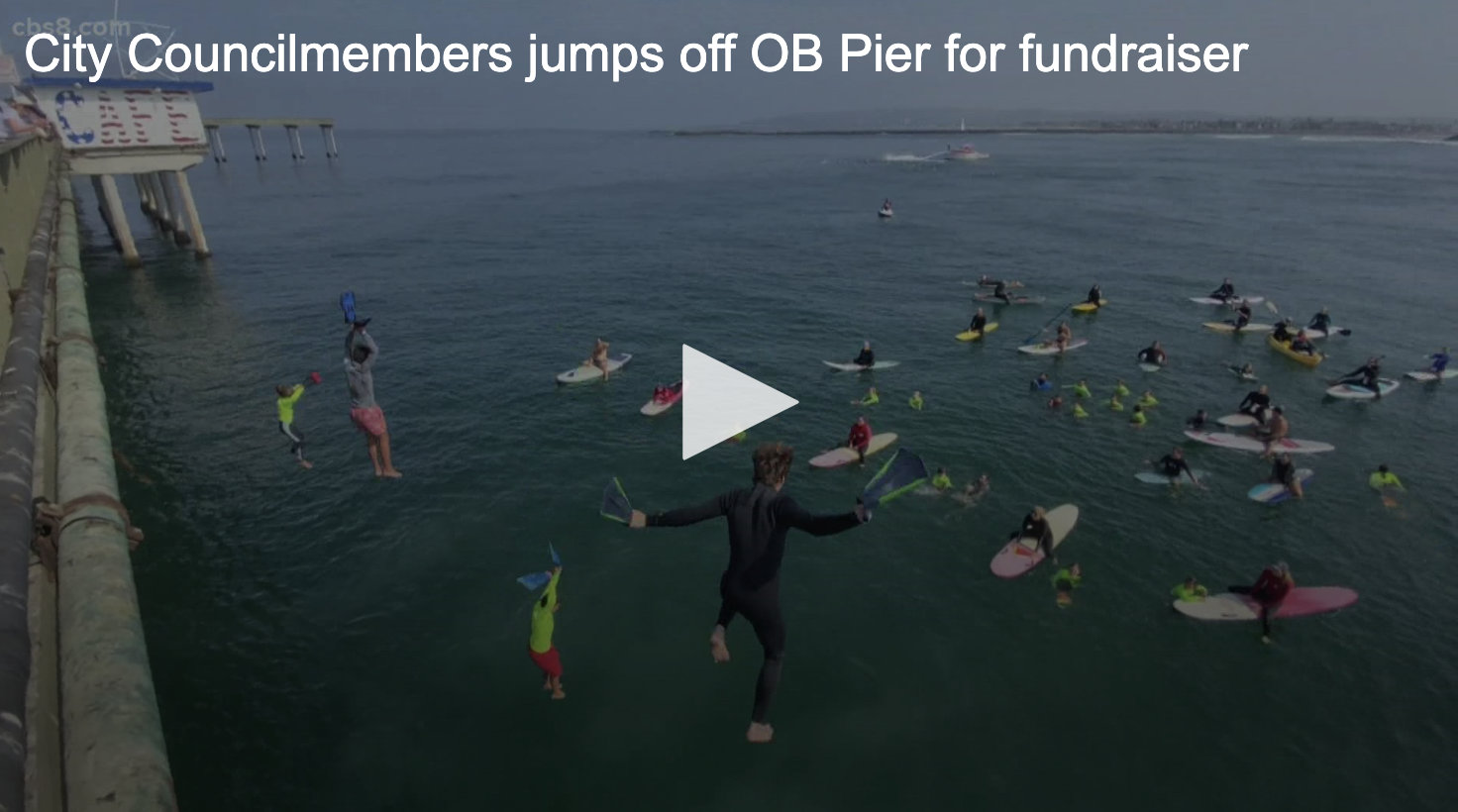 city council jumps off ob pier with junior lifeguards